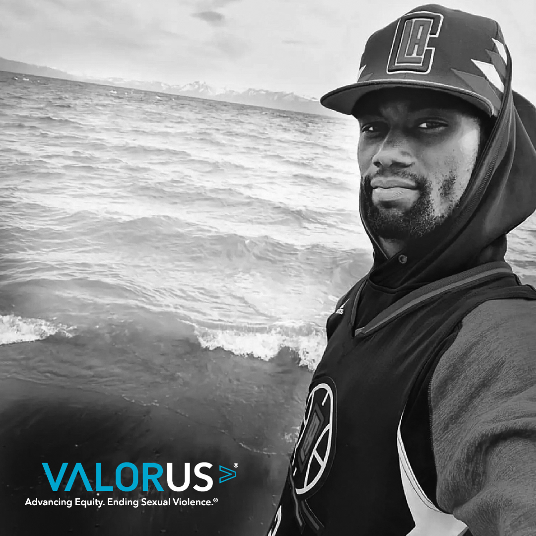 Tyre Nichols standing by the water. Valor U.S. logo and tagline
